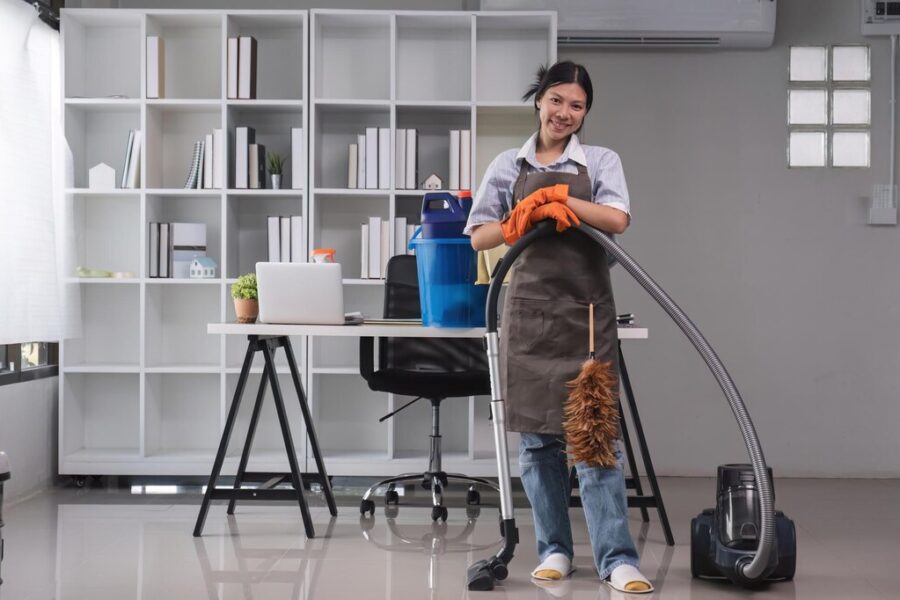 cleaning-office-beautiful-cleaning-lady-uses-mop-vacuum-cleaner-clean-floor_49553-4971